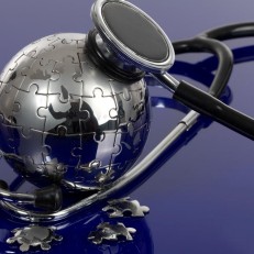 a stetoscope and a 3d Earth puzzle-globe